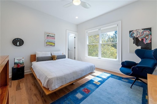 bedroom with ceiling fan, baseboards, wood finished floors, and recessed lighting