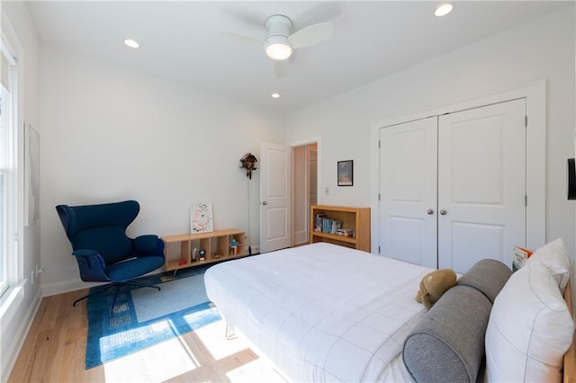 bedroom featuring recessed lighting, a closet, and light wood-style flooring