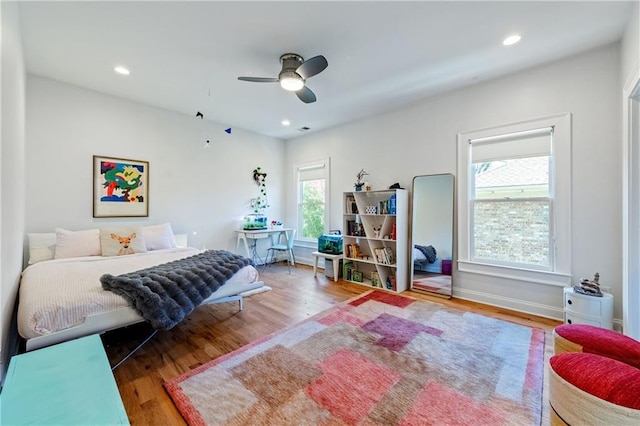 bedroom with recessed lighting, baseboards, wood finished floors, and ceiling fan