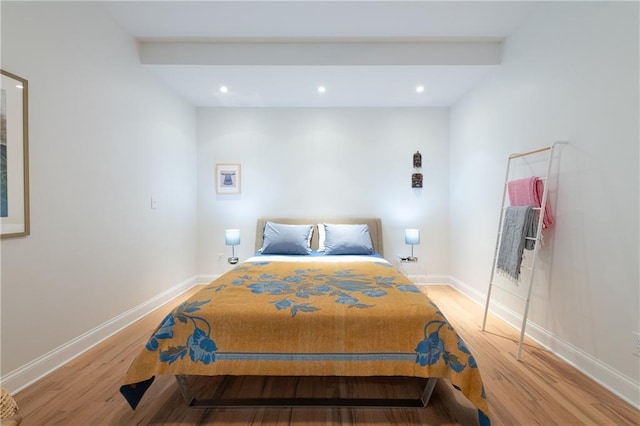 bedroom with recessed lighting, light wood-type flooring, and baseboards