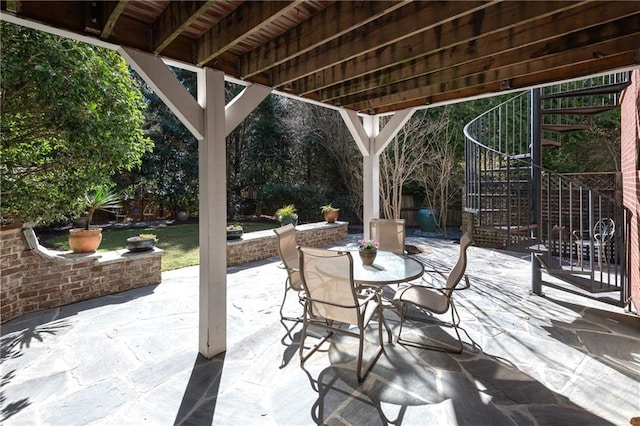 view of patio / terrace with outdoor dining space and stairway