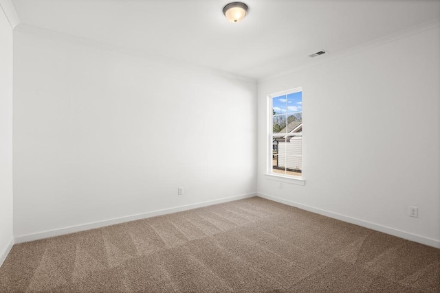 unfurnished room with crown molding, carpet floors, and baseboards