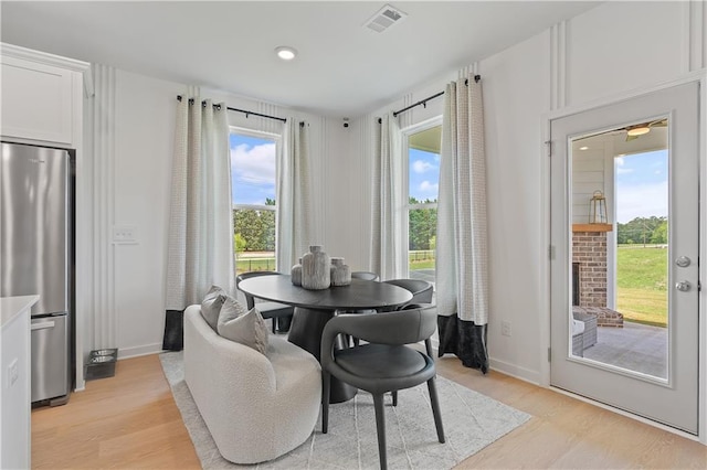 dining space featuring light hardwood / wood-style floors