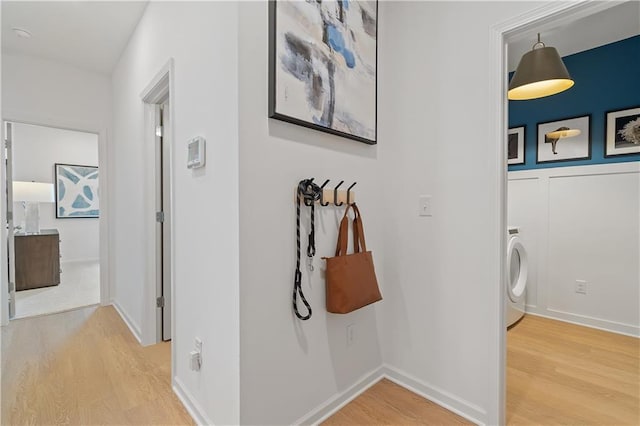 hall featuring hardwood / wood-style floors and washer / clothes dryer