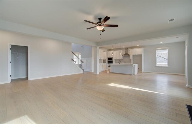 laundry area featuring light hardwood / wood-style floors and washer and clothes dryer