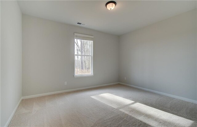 corridor with light colored carpet