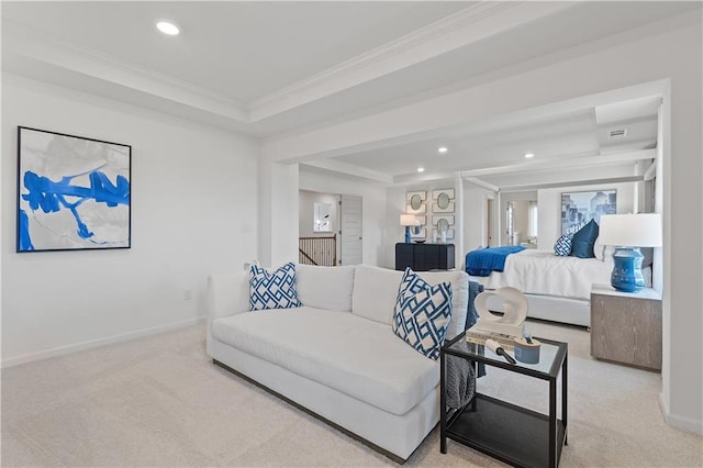 carpeted bedroom with ornamental molding and a tray ceiling