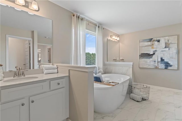 bathroom featuring a bathing tub and vanity