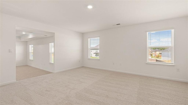 empty room with light colored carpet