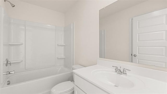 full bathroom featuring toilet, vanity, and washtub / shower combination