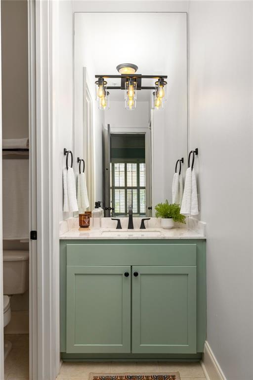 461 Bartram St SE Unit A, Atlanta, GA 30316 - bathroom with toilet, vanity, and baseboards