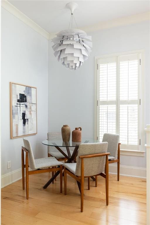 461 Bartram St SE Unit A, Atlanta, GA 30316 - dining space with light wood-type flooring, ornamental molding, a chandelier, and baseboards
