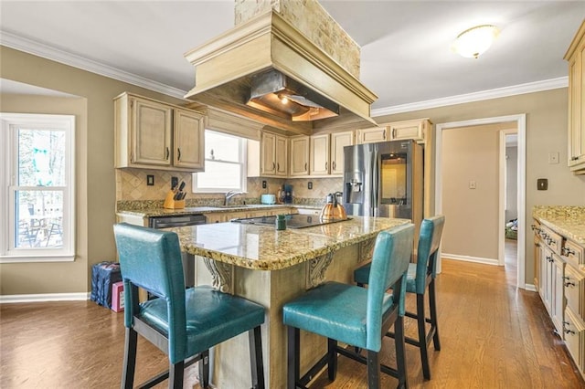 kitchen with black electric cooktop, dark wood-style floors, stainless steel refrigerator with ice dispenser, and ornamental molding