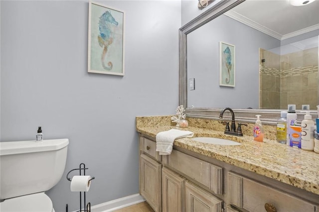 full bathroom with vanity, crown molding, toilet, and baseboards