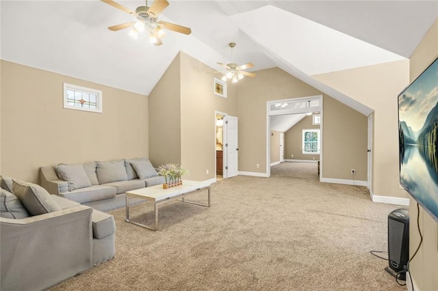 carpeted living room with visible vents, plenty of natural light, baseboards, and lofted ceiling