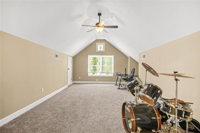 exercise area with visible vents, lofted ceiling, baseboards, and carpet flooring