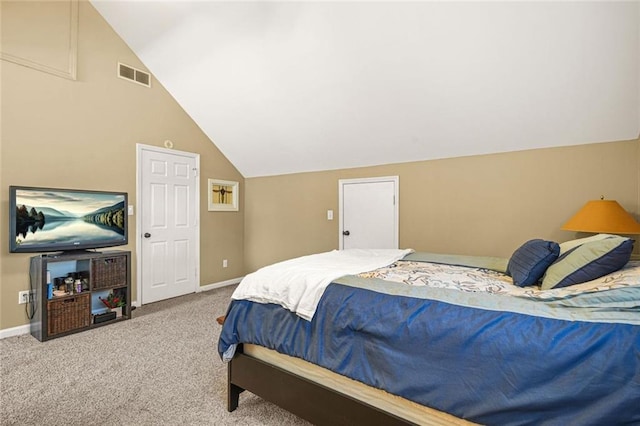 carpeted bedroom featuring lofted ceiling, baseboards, and visible vents