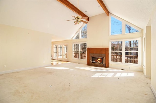 unfurnished living room with beam ceiling, light colored carpet, ceiling fan, and high vaulted ceiling