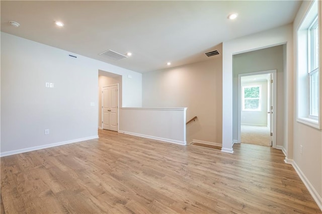 unfurnished room featuring light hardwood / wood-style flooring