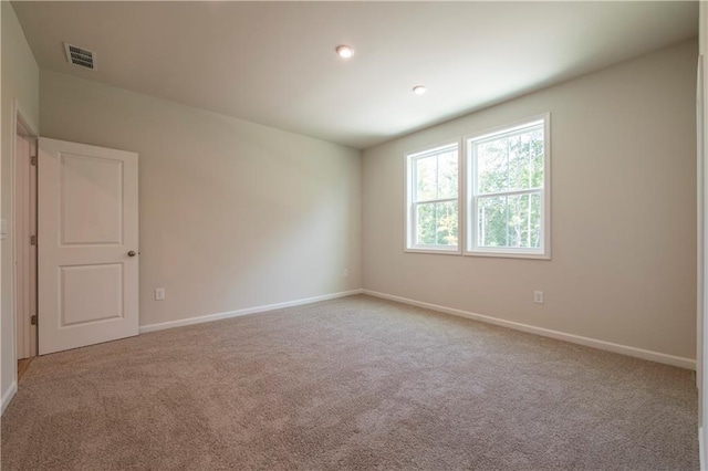 view of carpeted spare room