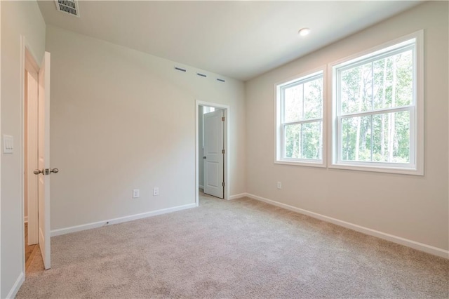 unfurnished bedroom with light colored carpet