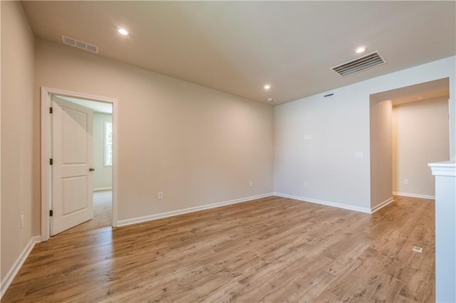 empty room with light hardwood / wood-style floors