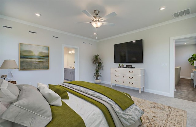 bedroom with ceiling fan, carpet, connected bathroom, and ornamental molding