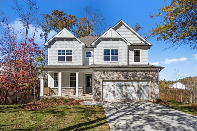 craftsman-style home featuring a front yard, a porch, and a garage