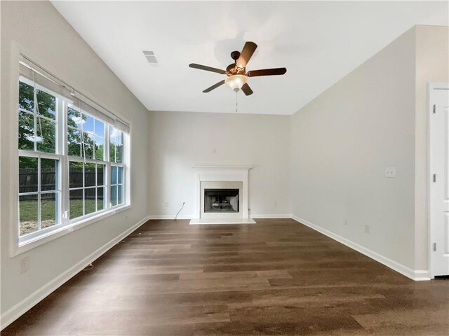 617 Kyles Cir, Hiram, GA 30141 - unfurnished living room with a ceiling fan, baseboards, dark wood-style flooring, and a fireplace