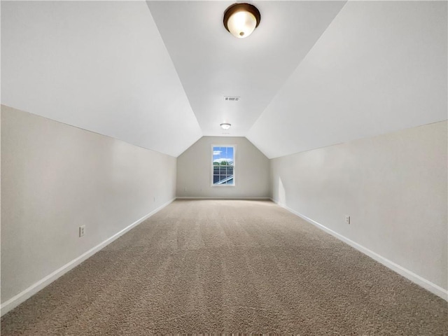 617 Kyles Cir, Hiram, GA 30141 - additional living space with vaulted ceiling, baseboards, and carpet flooring