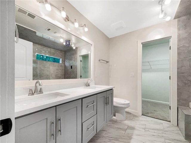 617 Kyles Cir, Hiram, GA 30141 - full bath with tiled shower, marble finish flooring, a spacious closet, double vanity, and toilet