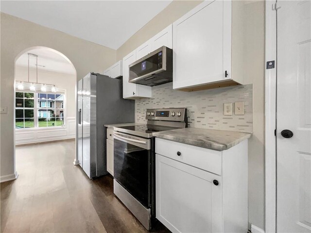617 Kyles Cir, Hiram, GA 30141 - kitchen featuring stainless steel appliances, dark wood-type flooring, white cabinetry, and tasteful backsplash