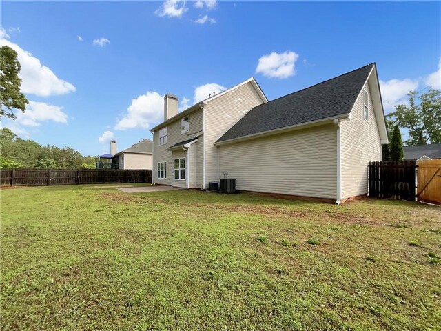 617 Kyles Cir, Hiram, GA 30141 - back of property featuring a patio area and a chimney
