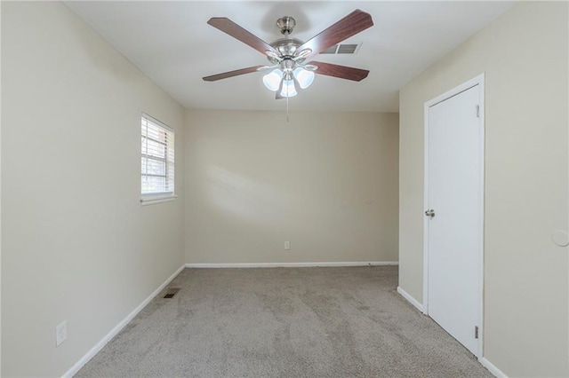 carpeted empty room featuring ceiling fan