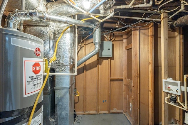 utility room with electric panel and gas water heater