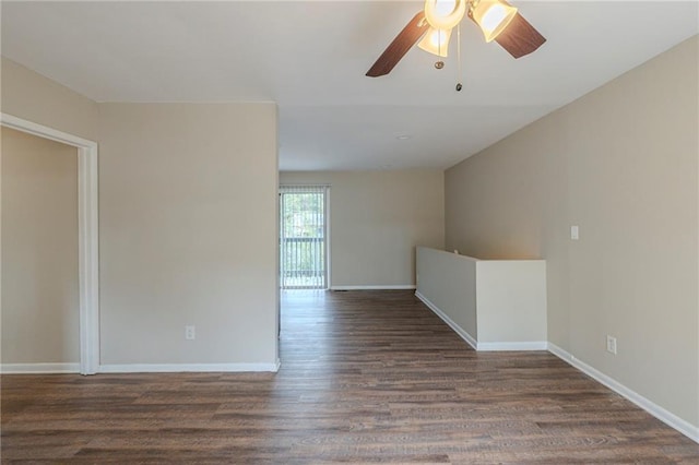 unfurnished room featuring ceiling fan and dark hardwood / wood-style flooring