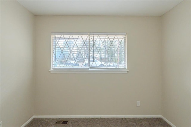 view of carpeted spare room