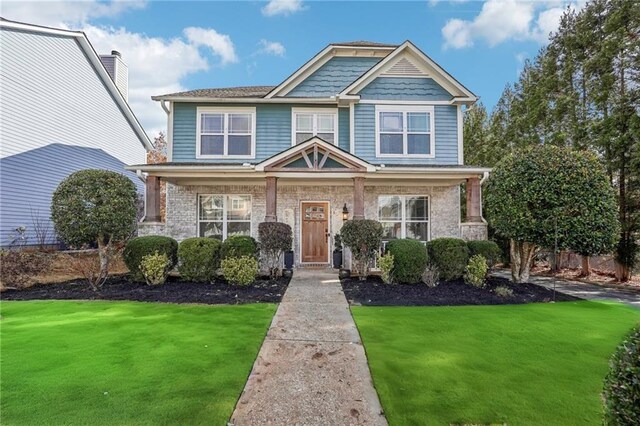 view of front facade featuring a front yard