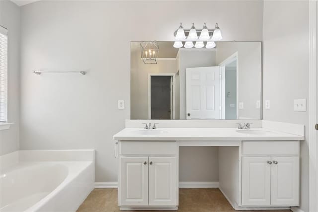 full bathroom featuring a garden tub, a sink, tile patterned floors, and double vanity