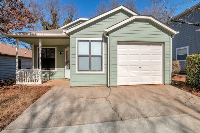 single story home with a garage and covered porch