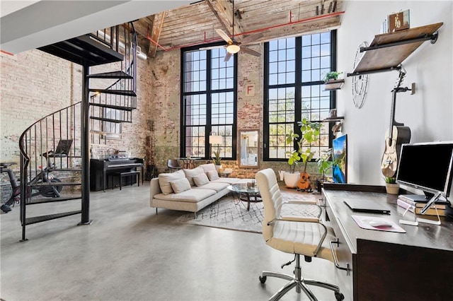 interior space with concrete flooring, a towering ceiling, wooden ceiling, brick wall, and beamed ceiling