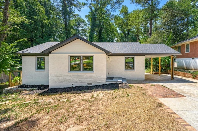 ranch-style house with a carport