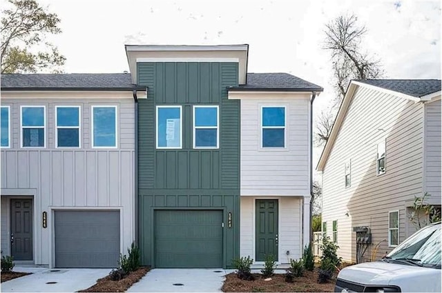 1648 Florence Run NW, Atlanta, GA 30318 - view of front of property featuring board and batten siding, concrete driveway, and a garage