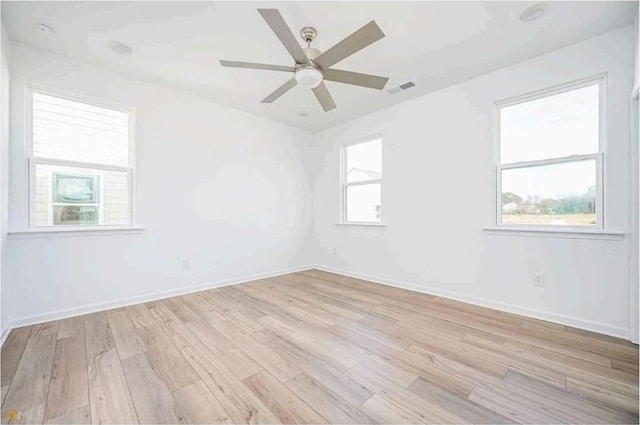 1648 Florence Run NW, Atlanta, GA 30318 - empty room with light wood-style flooring and ceiling fan