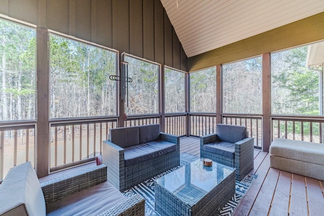 sunroom with an outdoor living space and a healthy amount of sunlight