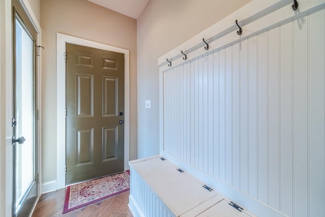 mudroom with a healthy amount of sunlight and baseboards