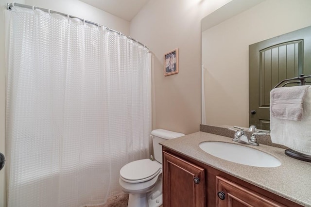 bathroom featuring vanity, a shower with curtain, and toilet
