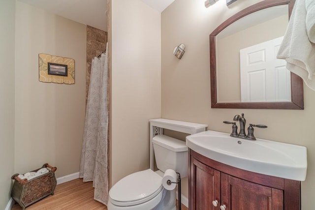 full bath with wood finished floors, curtained shower, vanity, baseboards, and toilet
