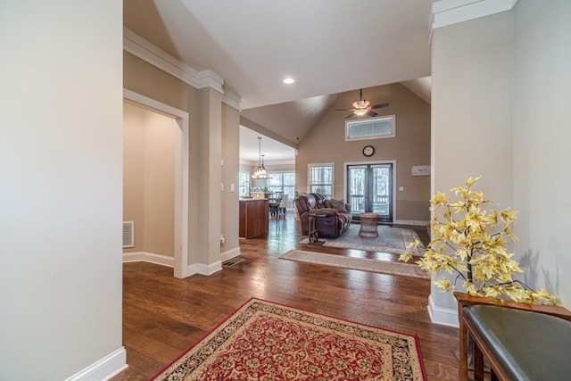 entrance foyer with a ceiling fan, baseboards, visible vents, and wood finished floors