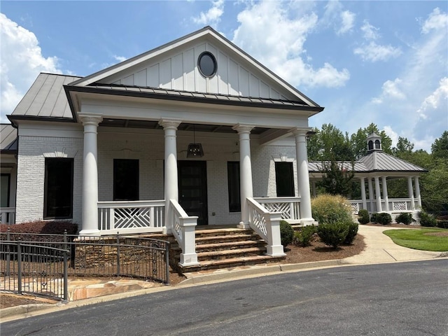 30 Riverrock Trl, Dallas, GA 30157 - greek revival house with a standing seam roof, brick siding, and covered porch